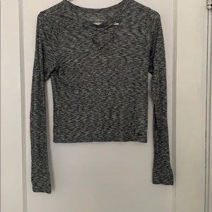 long sleeve grey shirt with detailing in the front
